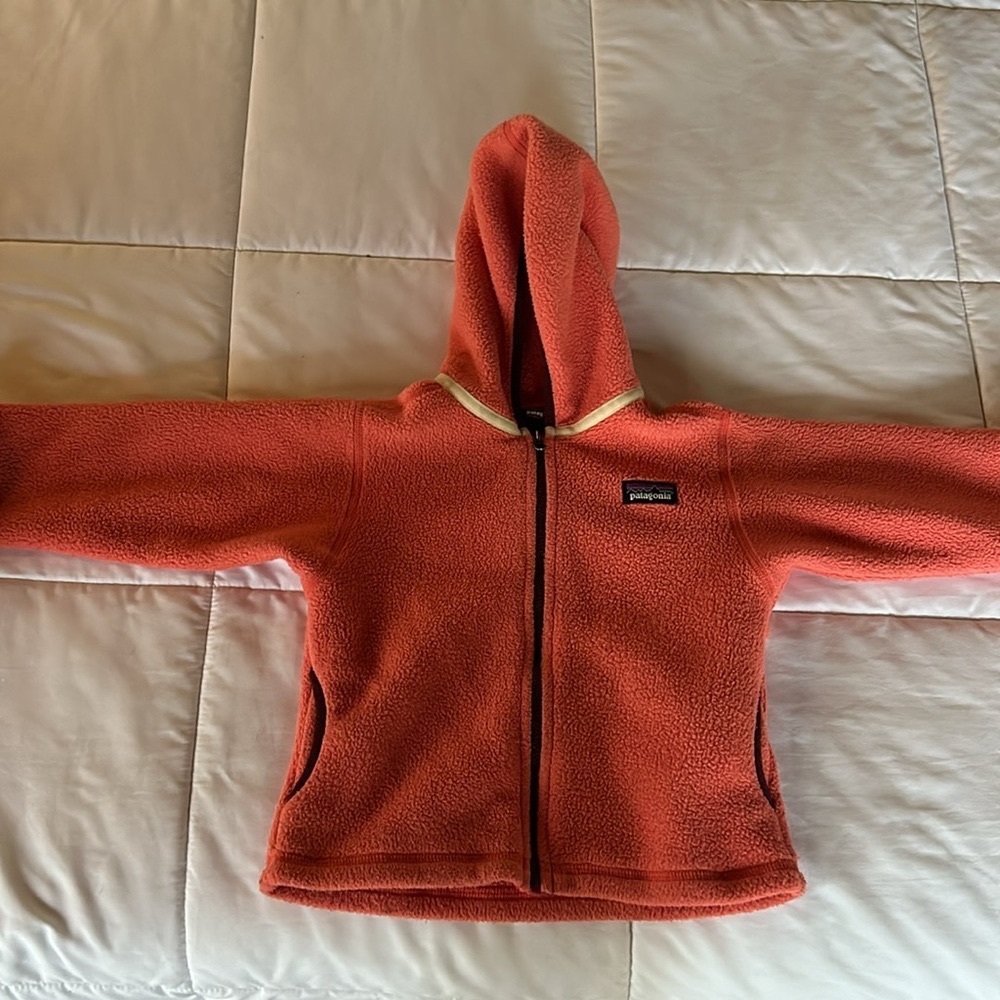 Patagonia fleece.  Pink w/ peach tint & trim blackberry color